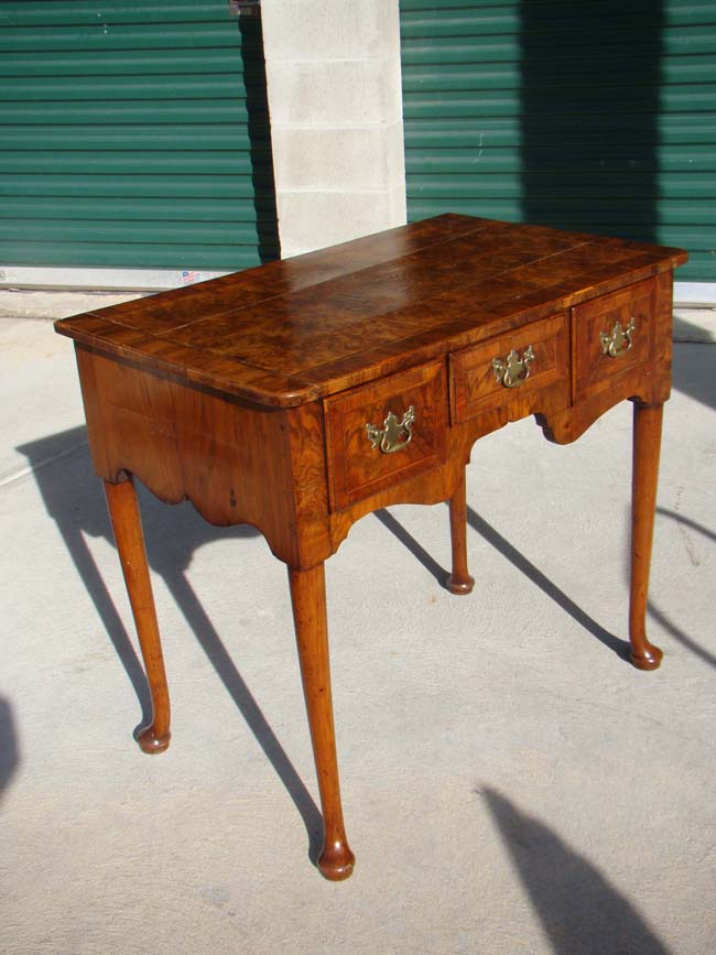 An English Queen Anne period walnut veneered dressing table circa 1710
